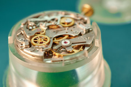Intricate details of a wristwatch mechanism showcase the beauty of precision engineering through...