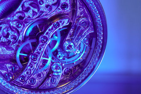 A stunning macro shot highlights the intricate beauty of a jewelry watch mechanism in radiant blue tones and delicate craftsmanshipの写真素材