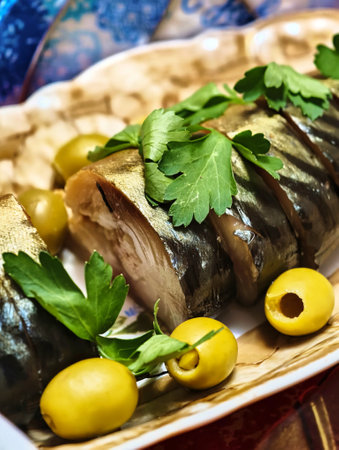 Delightful seafood dish garnished with fresh herbs and olives, perfect for a festive gathering in a cozy settingの写真素材
