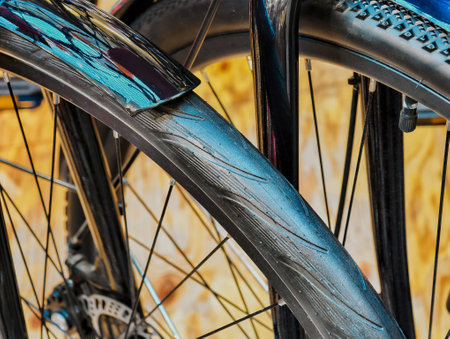Exploring the intricate details of a bicycle wheel in vibrant urban surroundings during midday