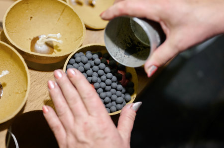 Crafting vibrant fireworks by hand in a meticulous workshop settingの写真素材