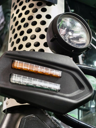 Intricate details of a modern vehicles safety lights and design elements captured in close-up at a...