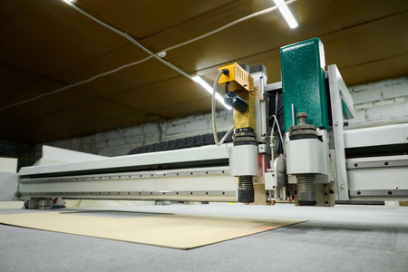 Precision machinery crafting intricate designs in a workshop using advanced CNC plotter technology...