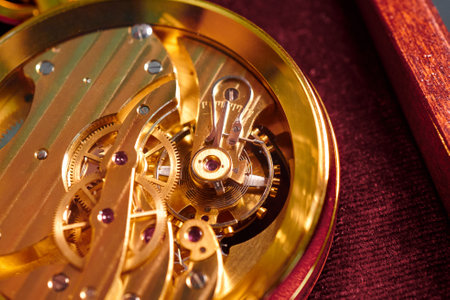 Intricate mechanics of a close-up mechanical watch revealing the artistry and precision behind its craftsmanshipの写真素材