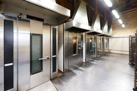 Rotary rack oven setup for confectionery baking in a professional kitchen environment with multiple unitsの写真素材