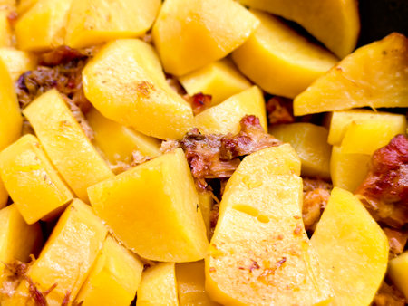 Delicious stewed potatoes infused with tender meat, showcasing an appetizing blend of flavors and textures for a comforting meal experienceの写真素材