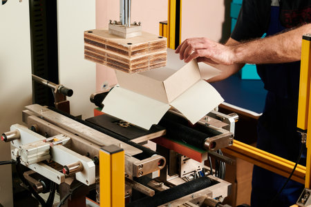 Innovative machine efficiently wraps rectangular boxes at a packaging facility to enhance...