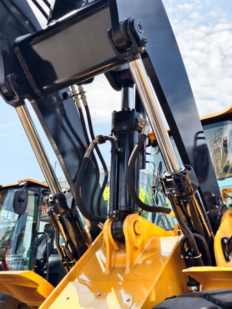 Heavy machinery in operation at a construction site during the day showcasing hydraulic systems and powerful equipmentの写真素材