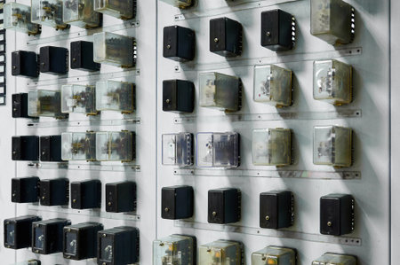 Wall of vintage electrical components displayed in an industrial setting for educational purposesの写真素材