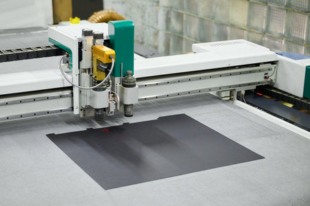 Precision cutting process using an industrial large-format CNC plotter for creative design work in a...