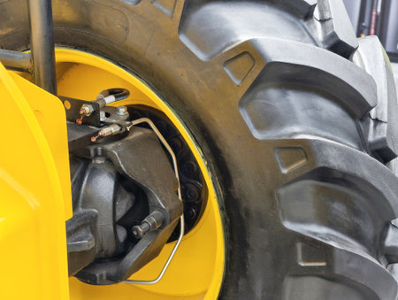 Heavy duty wheels of construction equipment designed for improved traction on rugged terrain and various construction tasksの写真素材