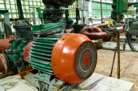 Industrial pump station with electric motors and piping infrastructure in a manufacturing facilityの写真素材
