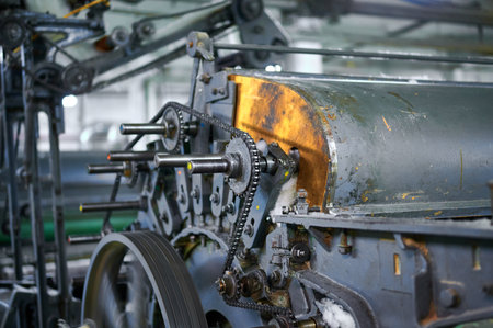 Innovative carding machine mechanism at work in a textile factory, showcasing the intricate engineering and designの写真素材