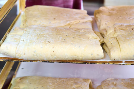Savoring the delicate nature of freshly prepared cracker dough in a cozy kitchen settingの写真素材