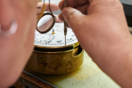 Precision artistry unfolds as skilled hands meticulously repair a chronometer, ensuring accuracy and...