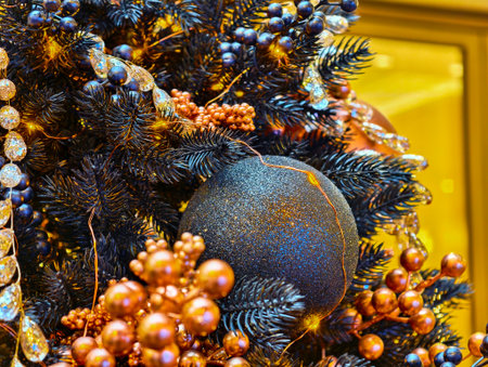Sparkling Christmas tree decorations adorned with shimmering ornaments and festive berries create a joyful holiday atmosphereの写真素材