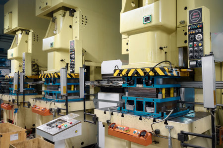 Cold metal stamping and pressing production line operating in a manufacturing facility