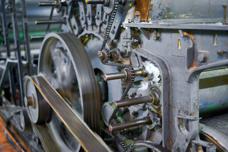 Exploring the intricate mechanisms of a carding machine in an industrial textile workshop during the...