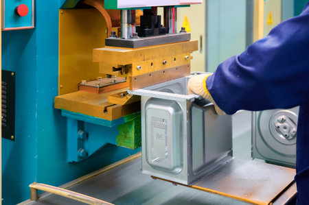 Spot welding process in manufacturing a microwave oven casing at an industrial facility in a...