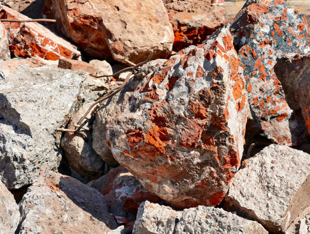 Colorful debris from a demolished structure in an urban construction site during daylightの写真素材