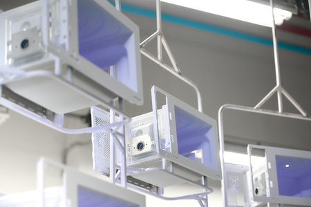 Powder coating process for microwave oven casings in a workshop with overhead conveyor system
