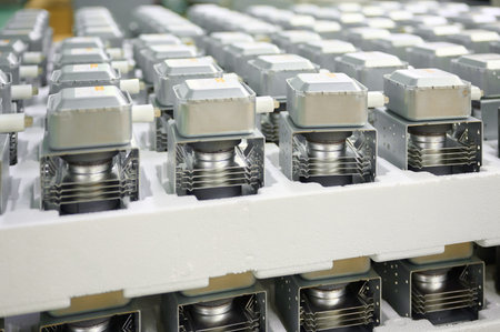 Magnetrons organized on pallets for manufacturing microwave ovens in a factory settingの写真素材