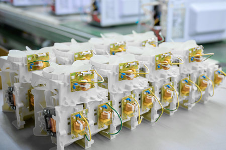 Fans for microwave ovens assembled in a factory setting showcasing intricate components and detailed...