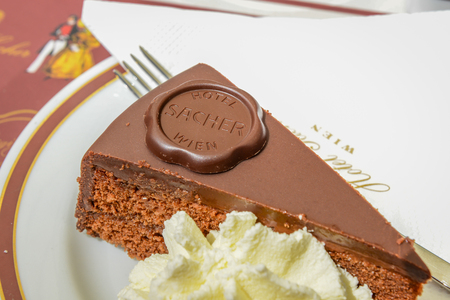VIENNA, AUSTRIA - JUNE 01. 2016: Original Sacher Torte with cream and fork at Sacher Cafe, Vienna, Austria, Europe june 01, 2016のeditorial素材