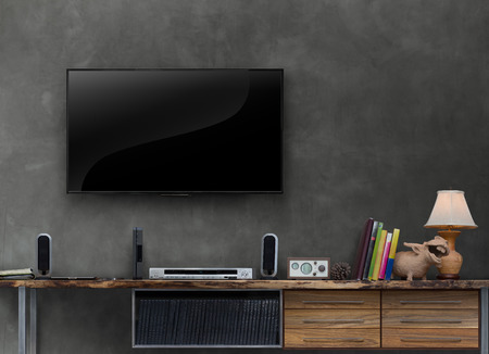 led tv on concrete wall with media furniturein living roomの写真素材