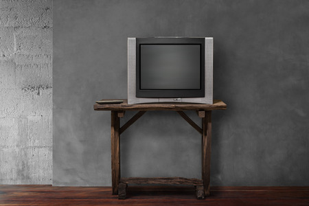 obsolete tv on old wooden in empty living roomの写真素材