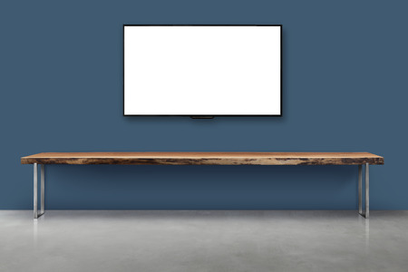 Led tv on color concrete wall with wooden table living room interior vintage styleの写真素材