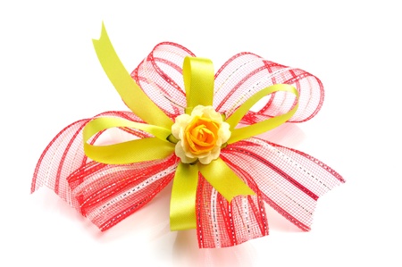 beautiful gift bow with artificial flower isolate on whiteの写真素材