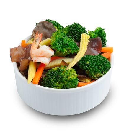 fried mix vegetable and shrimp in bowl isolate on whiteの写真素材