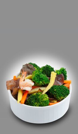 fried mix vegetable and shrimp in bowl on gray backgroundの写真素材