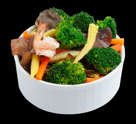 fried mix vegetable and shrimp in bowl isolate on blackの写真素材