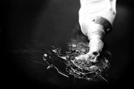 abstract glue stain on the plastic sheet in black and white shootの写真素材
