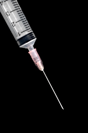 syringe isolated on blackの写真素材