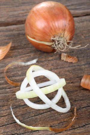 closeup onion on ancient wooden tableの写真素材