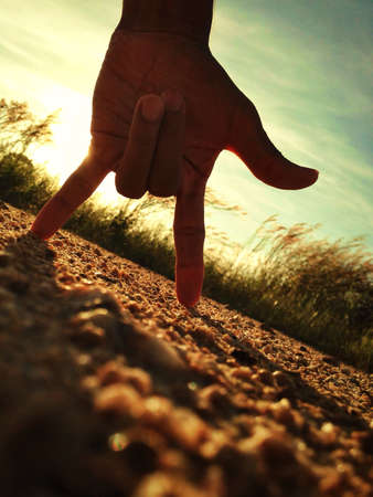 Hand sign of love on the groundの素材