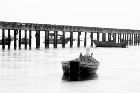boat on the sea in black and whiteの写真素材