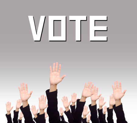 closeup businessmans raising hand to vote