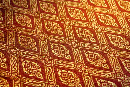 closeup golden pattern of Thai fabric の写真素材