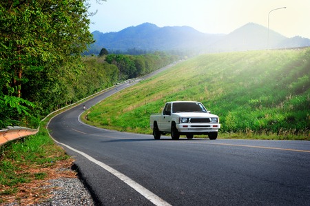 a truck running on the road 