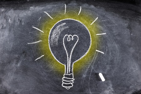 writing light bulb on chalk boardの写真素材