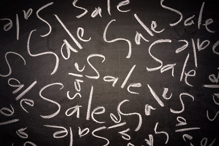 writing the word Sale on chalk boardの写真素材