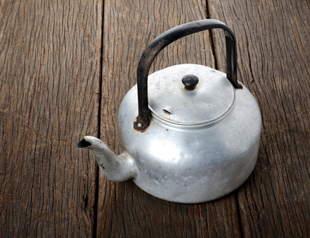 isolated old and grungy aluminium kettleの写真素材