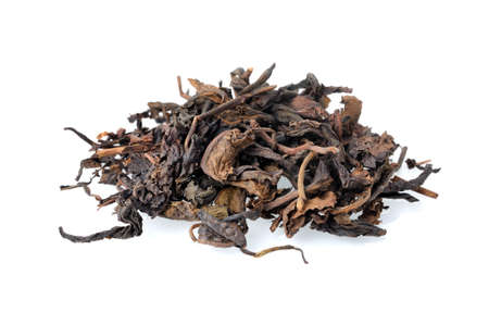 closeup dry chinese tea leaf isolated on white background