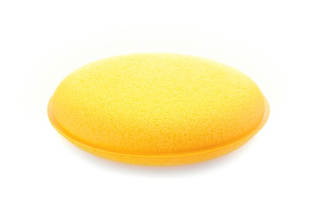 yellow double layer sponge for car waxing isolate on white backgroundの写真素材