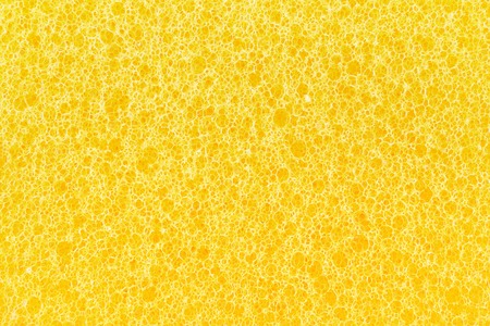 abstract yellow sponge texture backgroundの写真素材