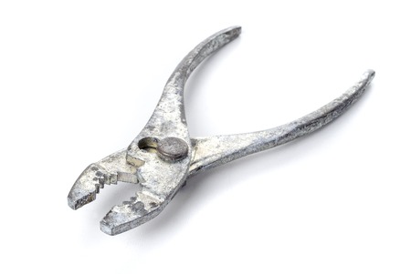 dirty metal pliers isolate on white backgroundの写真素材